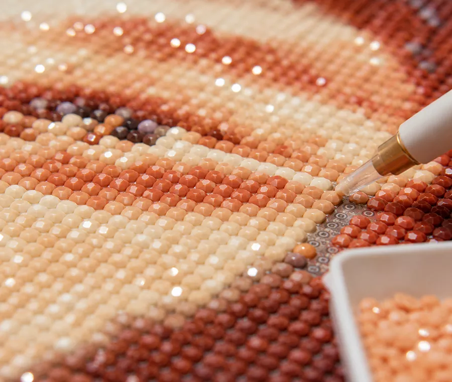 Close-up of faceted diamond painting drills catching the light