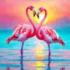 Two pink flamingos forming a heart at sunset over turquoise water