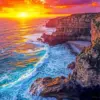 Golden Sunset Coastal Cliffs diamond painting kit — colorful sunset over rugged ocean cliffs and crashing waves