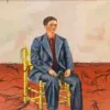 Frida Kahlo in a blue suit seated among strands of cut hair