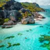 Seychelles diamond painting kit — turquoise ocean water, granite boulders, and tropical coastline